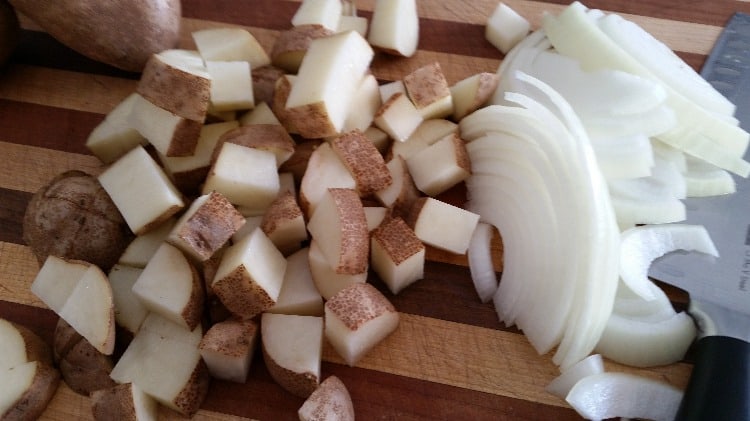 Meal prep includes chopping potatoes & onions